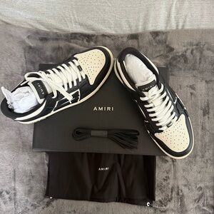 AMIRI Black and White Sneakers with Bold Stripe Design